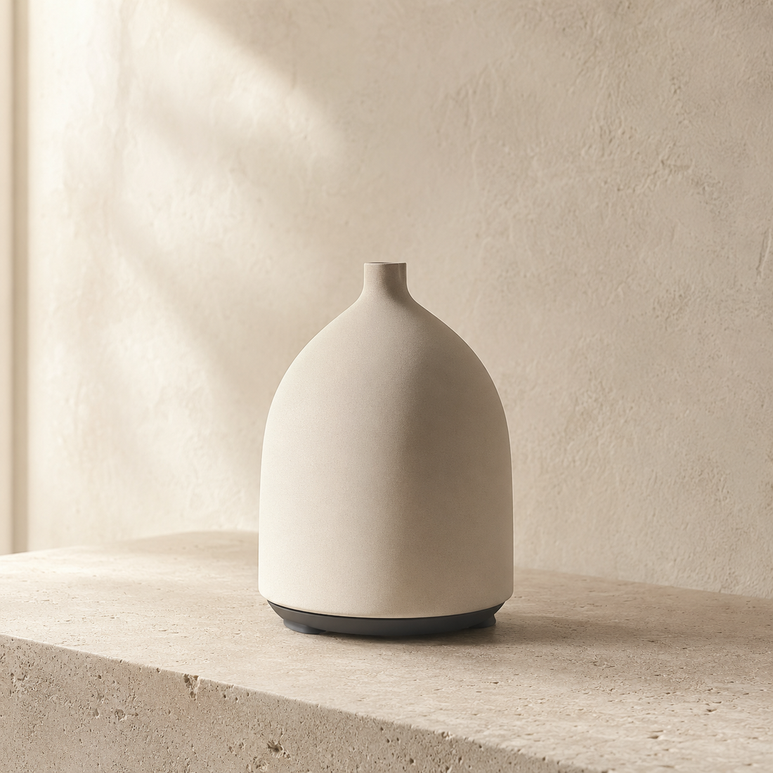 Sculptural aroma diffuser in a quiet neutral interior