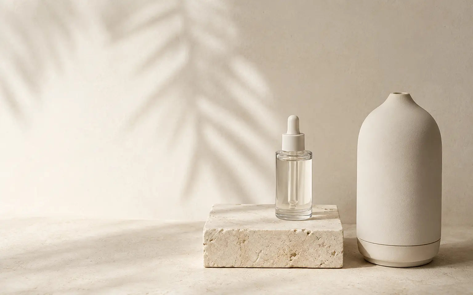 SŌVA diffuser and essential oil on pale stone